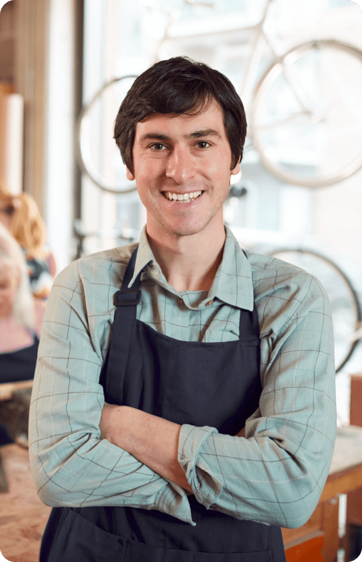 A restaurant guy with folded hands